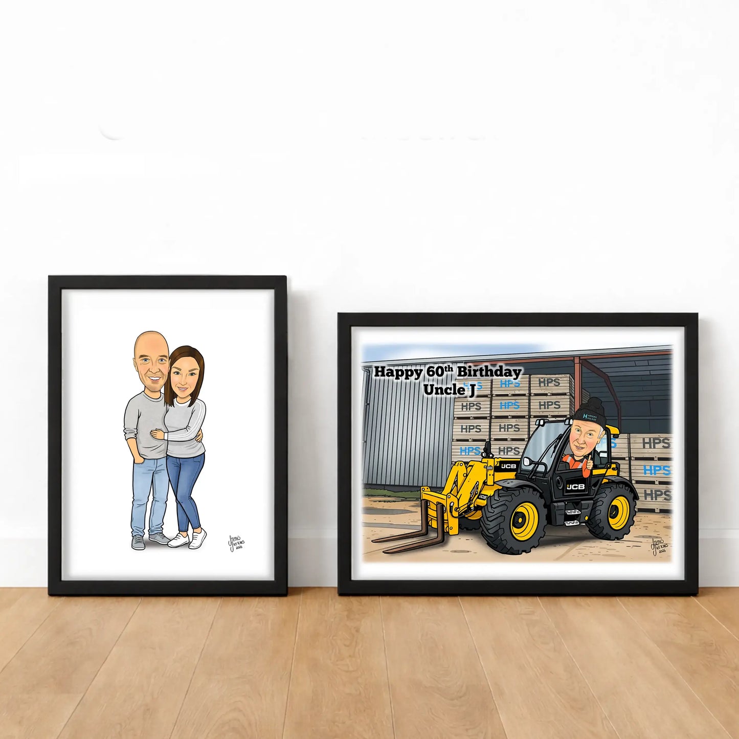 Two framed caricatures on a wooden floor with a white wall background.