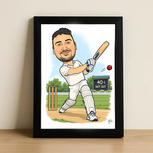 A framed custom caricature art print of a cricket player batting, leaning against a neutral wall on a wooden surface.