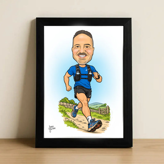 A framed caricature portrait print of a man running outdoors, shown leaning against a light beige wall on a wooden surface. The artwork is inside a black frame and features a blue shirt, black shorts, and a light blue sky background.