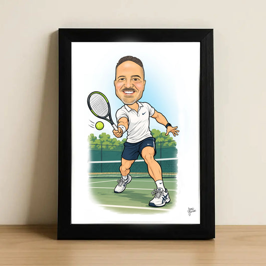 A framed caricature art print of a tennis player, leaning against a neutral wall on a light wooden surface. The print features a cartoon illustration of a man in a white polo shirt and navy shorts on a tennis court, enclosed in a black frame.